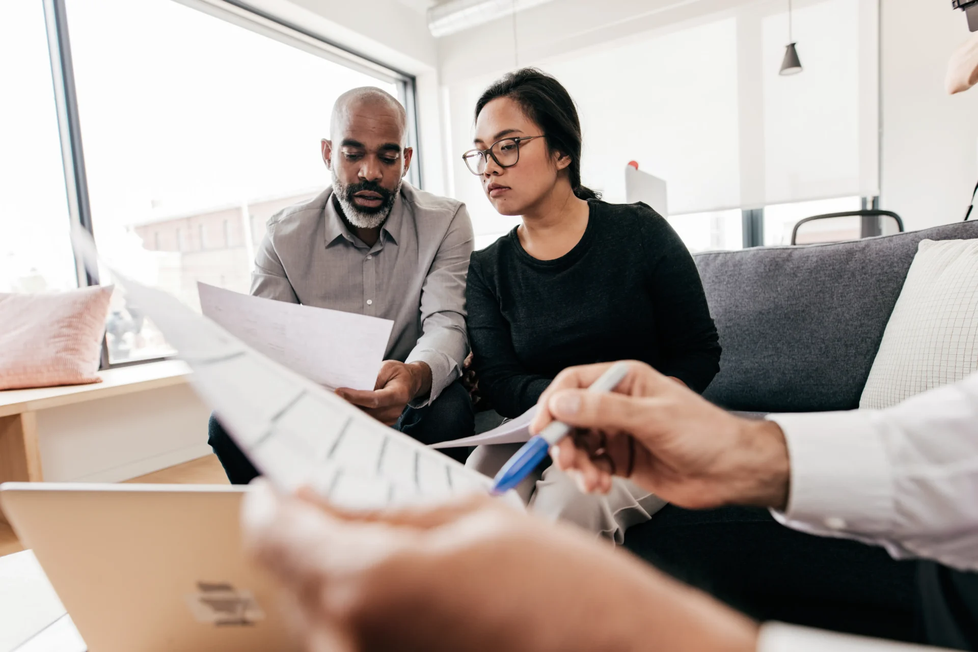 People reviewing documents in an office setting.