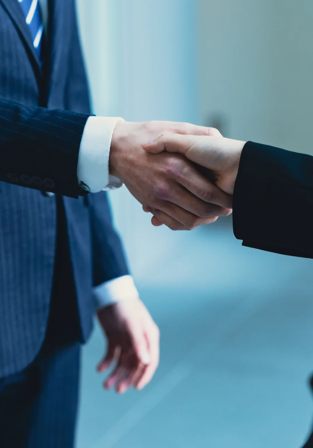 Professional agreement handshake in office